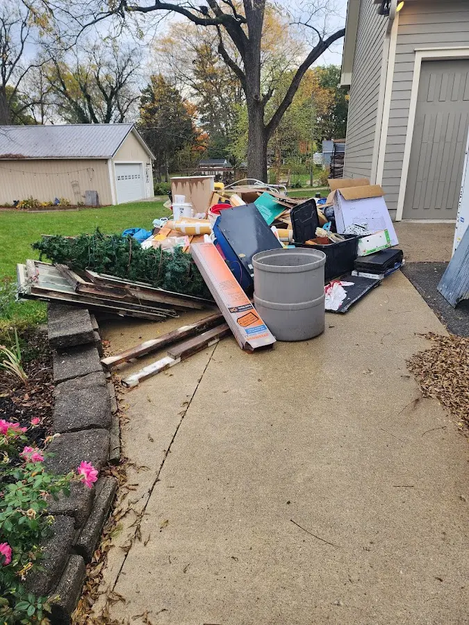 Dumpster being loaded with debris for Residential Dumpster Rental in Riverside